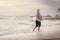 Senior Asia woman dancing on the beach