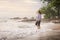 Senior Asia woman walking on the beach