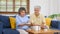 Senior asian couple take pill medicine for elderly health care while sitting on sofa, Retirement couple take vitamin pill, Senior