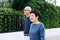 Senior Asian couple walking in the park of residential house
