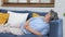 Senior asian woman sleeping on sofa, Asian female elderly take a nap at home living room in day, Old, retirement people lying and