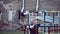Senior bearded man with strong muscular arms exercising outdoors, doing pull ups, elderly male performing pulling exercise on hori