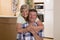 Senior beautiful middle age couple around 70 years old smiling happy together at home kitchen looking sweet in lifetime husband an