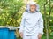 Senior beekeeper working at his apiary