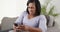 Senior black woman upset using smartphone