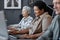 Senior black woman using computer and smiling in school for elderly people