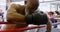 Senior boxer leaning on the boxing ring 4k