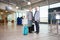 Senior Business Couple Smiling With Receptionists Working In Air