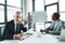 senior businessman looking at camera while having conversation with colleagues