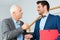 Senior businessman passing keys to younger man