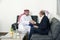 Senior Businessman Shaking hands with Arabian Businessman