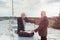 Senior businessmen making a business deal on the roof of a build