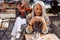 Senior cafe guests, focus on pretty silver haired lady holding cup of drink