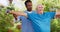 Senior care, weightlifting for exercise and physio, old man and caregiver in garden with rehabilitation and healing