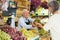 Senior cashier serving customer in greengrocer