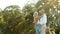 Senior Caucasian couple hugging in park. Family with a happy smile feels relaxed with nature