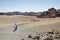 Senior Caucasian couple visiting the unusual sand dunes at Minas de San Jose solitary lunar landscape in Teide National Park