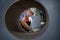 Senior caucasian engineer worker is examining the stainless galvanized metal sheet roll inside the warehouse factory for roofing