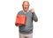 Senior caucasian man holding gift annoyed and frustrated shouting with anger, yelling crazy with anger and hand raised