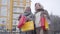 Senior Caucasian women strolling on city street after shopping. Happy active middle-aged retirees enjoying leisure time