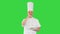 Senior chef add spices in salad on a Green Screen, Chroma Key.