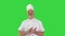 Senior chef applauding to camera and smiling on a Green Screen, Chroma Key.
