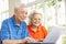 Senior Chinese Couple Using Laptop At Home