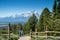 Senior citizen tourists enjoy taking photos on top of Signal Mountain Overlook in Grand Teton