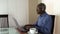 Senior citizen working on a laptop at home in Arizona.