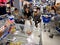 Senior citizens sit on chairs while waiting in a special lane dedicated for them at a grocery store in Antipolo City.