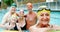 Senior citizens smiling in swimming pool