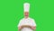 Senior cook with a pizza in hands walking on a Green Screen, Chroma Key.