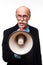 Senior cool man with a megaphone on white background