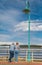 A senior cople pensioners standing by the sea at the port. Active elderly concept