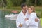 Senior couple in bathrobe standing on pontoon