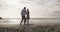 Senior couple, beach and dancing for care support and relax wellness on weekend adventure in nature. Mature man, woman