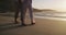 Senior couple, beach walk and embrace in sunset and married on holiday, outdoor and retirement. Affection, elderly and