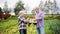 Senior couple with box of vegetables on farm