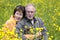 Senior couple in a buttercup field