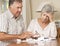 Senior Couple Concerned About Debt Going Through Bills Together