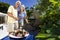 Senior Couple Cooking on A Summer Barbecue