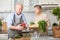 Senior couple cooking vegetarian meal