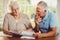 Senior couple counting bills