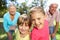 Senior couple on country walk with grandchildren