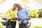 Senior Couple On Cycle Ride In Countryside