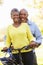 Senior Couple On Cycle Ride In Countryside