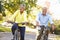 Senior Couple On Cycle Ride In Countryside