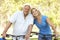 Senior Couple On Cycle Ride In Park