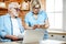 Senior couple with documents and laptop at home