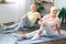 Senior couple doing yoga together at home health care leg stretching